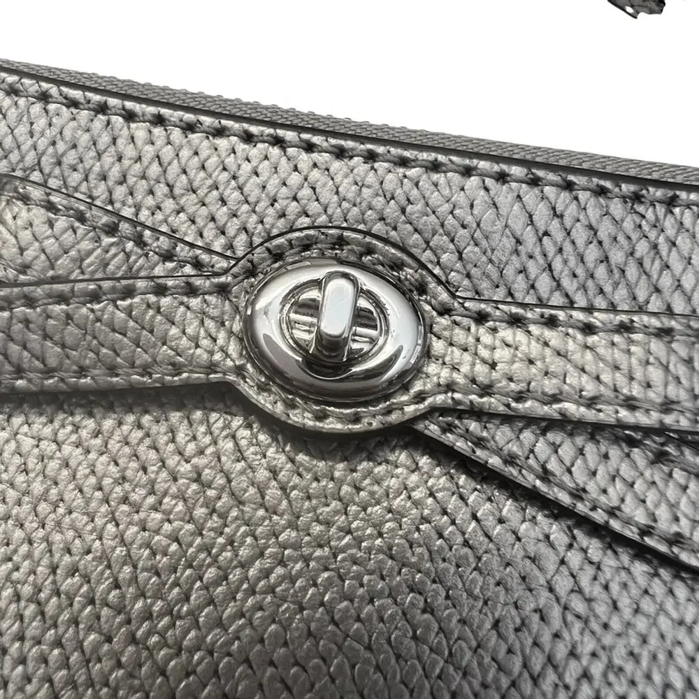 EUC Coach Metallic Silver Wristlet with Bow Detail